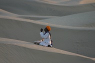 Praying in Sam Sand Dunes