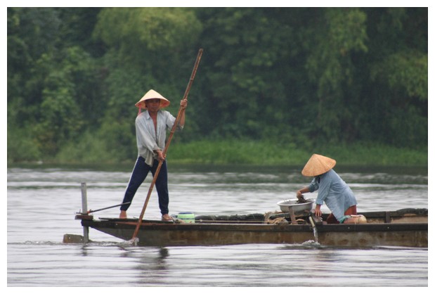 Removing mud at Perfume River